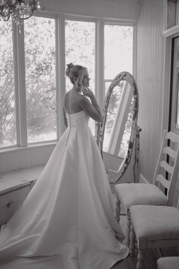 Black and white photo of a bride getting ready at Gansberg Ranch wedding venue in NV.