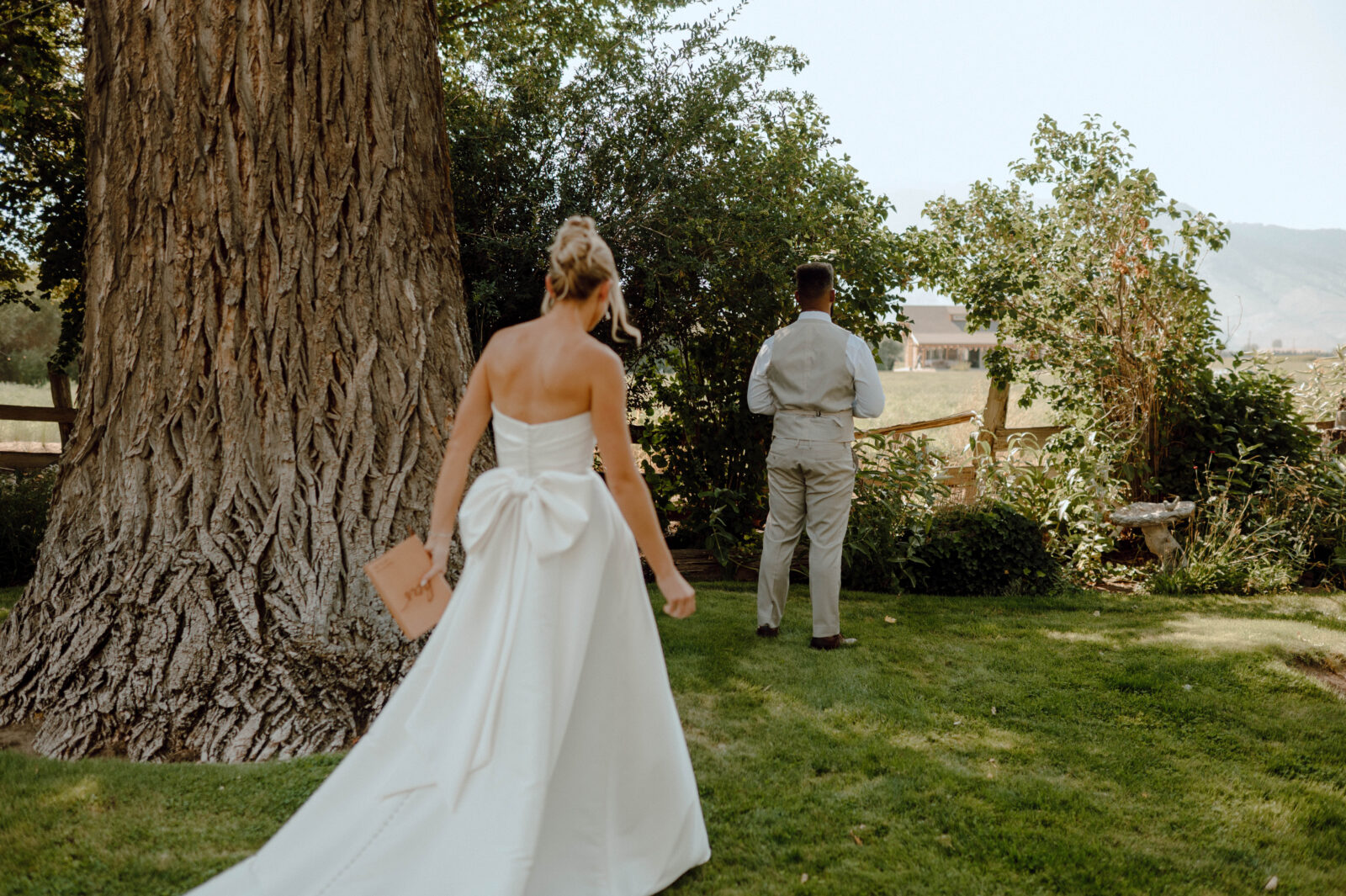 Bride walking up to share a first look with her groom.