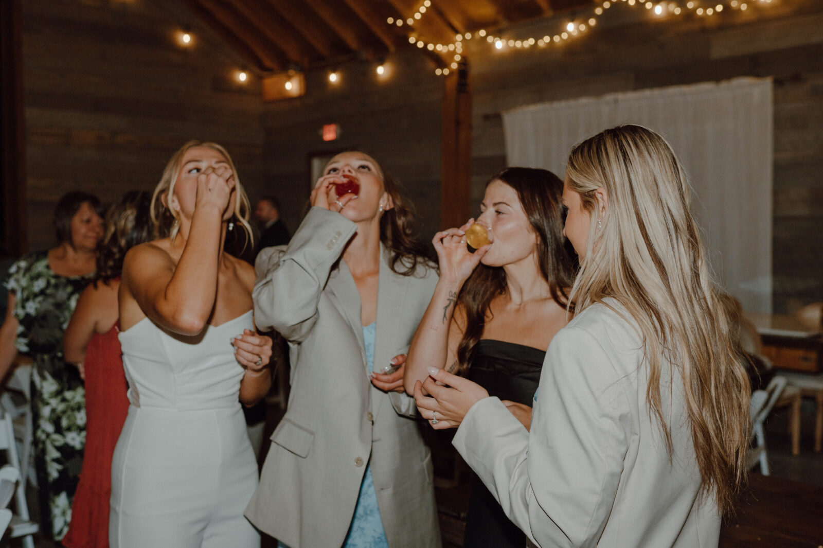 Bride taking shots with guests during her reception.