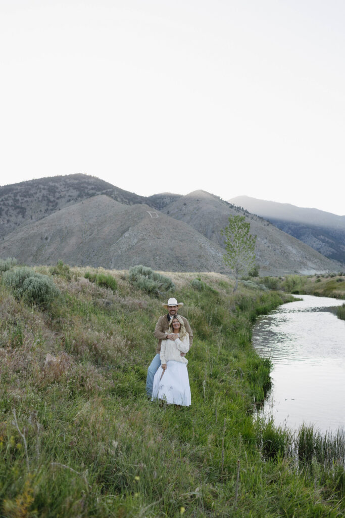 Couple posing with Jobs Peak behind them for their mountain engagement photos in Genoa, Nevada. 