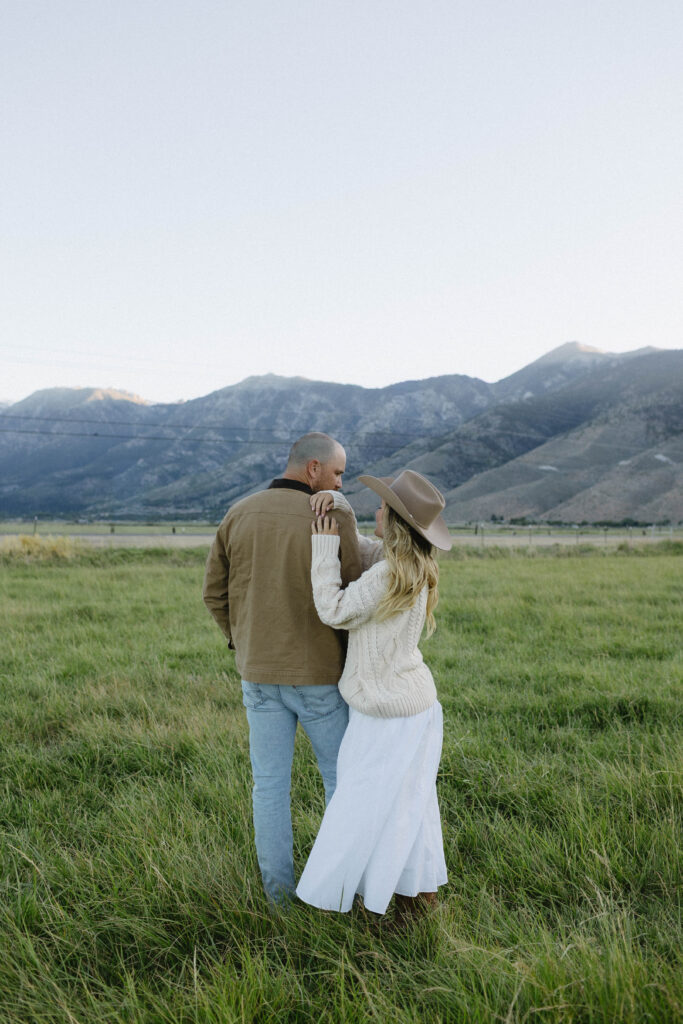 Couple posing with Jobs Peak in the background during their Genoa Nevada engagement photos. 